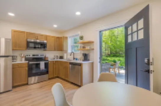 Serene 2-bedroom apartment with WiFi in Ellsworth with a backyard stream.