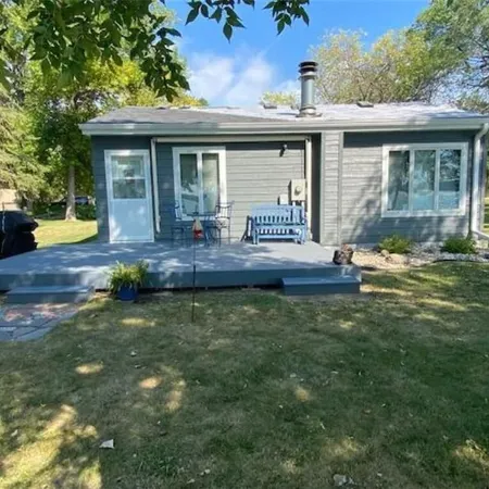 Year round cabin on level lot with dock