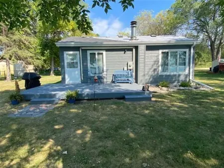 Year round cabin on level lot with dock