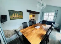 Charming  Listed Thatched Cottage with parking and short walk to sandy beach .