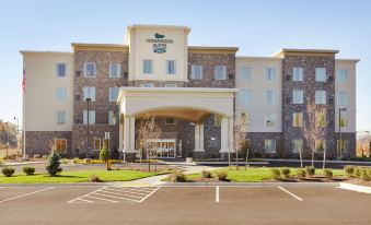 "a large building with a green sign and the words "" homewood suites by hilton "" on top" at Homewood Suites by Hilton Frederick