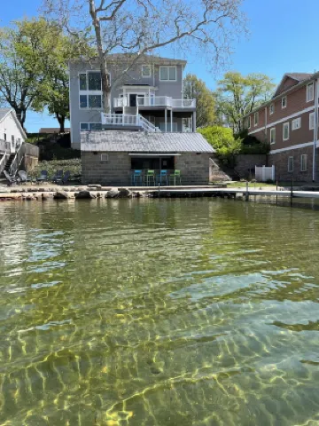 Spacious House + boat house on clear, sandy-bottom lake. Arcade + Billiards room