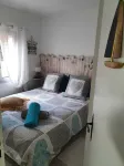 Quiet garden-level apartment with sea view