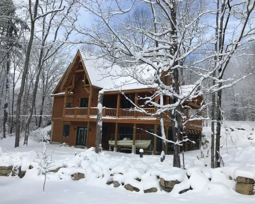 Luxury Log home steps from private beach in Meredith on Lake Winnipesaukee. Hotels in Meredith