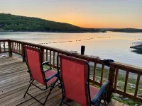 AMAZING WATERFRONT HOME WITH HOT TUB. BOTH HAVE EXTENSIVE VIEWS OF THE LAKE