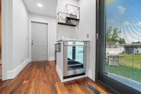 High-end home w/ fireplace, gourmet kitchen, sauna, game rm/ large yard/fire pit