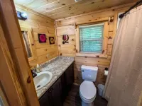 Secluded cozy tiny cabin on the water with fire pit and private dock