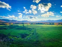 Modern barn perched on 24 acres w/ stunning views of mountains & ski resort