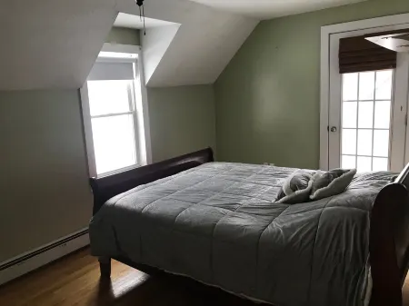 Winnipesaukee lakefront house includes slip, deck, hot tub & sleeps up to 11