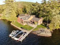 Beautiful Brant Lake home with direct lakefront, hot tub and snowmobile access!