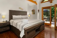 Waterfront Cabin with Hot Tub and Outdoor Fun - Cozy River Retreat