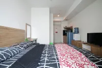 Studio Room with Netflix at Apartemen Grand Kamala Lagoon by Apartemenku