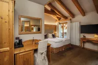 Boutique Hotel e Chalets Salvadori فنادق في Cogolo