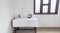 Charming 1-bedroom house in Koyilandy with WiFi access 코이랜디 호텔