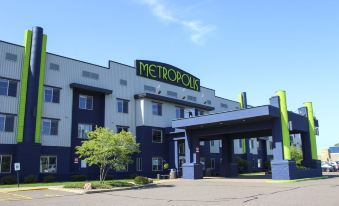 "a large hotel building with a sign that reads "" the metropoli "" prominently displayed on the front of the building" at Metropolis Resort - Eau Claire