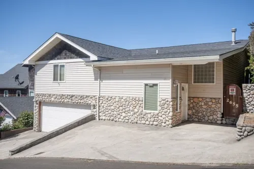 Dramatic oceanfront views. Open high ceilings. Huge deck & walls of windows!