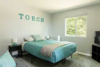 Spacious home near Torch Lake w/custom back patio, steps away from public access