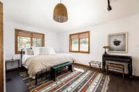 Centrally located cozy cottage tucked into the woods, a perfect family retreat