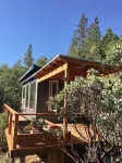 Off-grid tiny home on 6 secluded acres w/ outdoor soaking tubs and sauna!