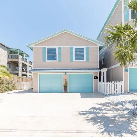 Waterfront home with dock, heated pool, & spectacular views- walk/bike downtown!