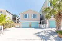 Waterfront home with dock, heated pool, & spectacular views- walk/bike downtown!