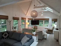 Bright Scandinavian-style cottage with large, private wooded yard