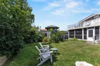 Ocean view spacious 5-bedroom Cape Cod style house with roof deck, AC, WiFi.