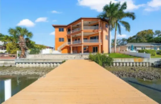 Indulge in Luxury at This Expansive Three-Story Waterfront Retreat.