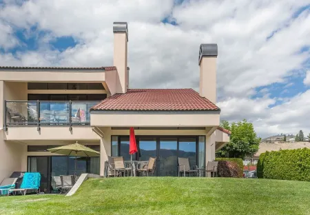 Luxury waterfront townhouse w/ sandy beach outside your patio door! WOW!