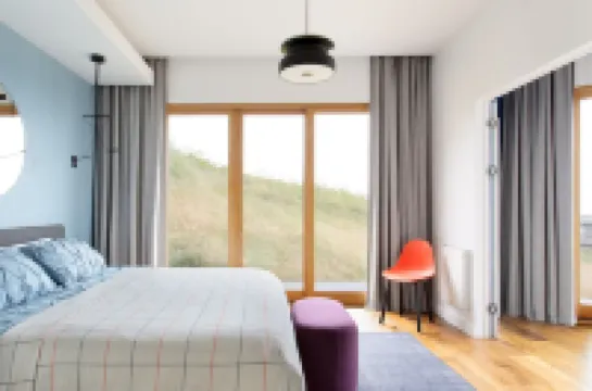 Sky House • Boutique seaside retreat with cinema room and spa