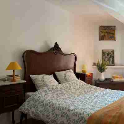 Provençal farm among olive trees; view of the hill from a large shaded terrace Rooms