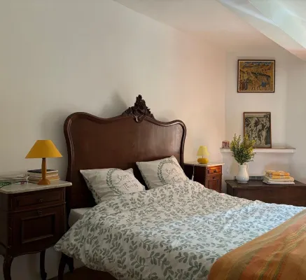 Provençal farm among olive trees; view of the hill from a large shaded terrace