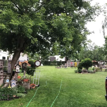 Large Private Fenced Yard with Guest Patio, Fire Pit and Surrounding Gardens.