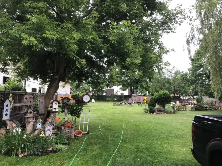 Large Private Fenced Yard with Guest Patio, Fire Pit and Surrounding Gardens.