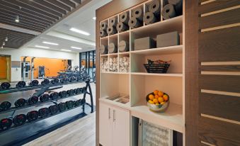 a well - equipped gym with various exercise equipment , including weights and treadmills , as well as a variety of sports equipment at Even Hotel Rockville - Washington DC Area