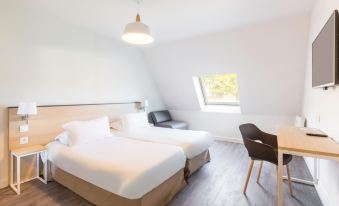 a modern bedroom with two beds , a chair , and a window , all decorated in white and brown colors at Best Western Armor Park Dinan