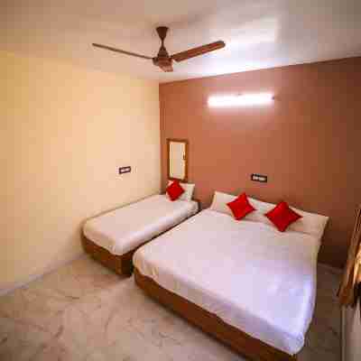 The Pothigai Palace Rooms