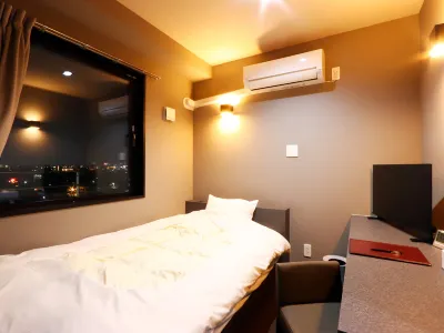 Shinkaiso Hotels near Nippon Bunri University