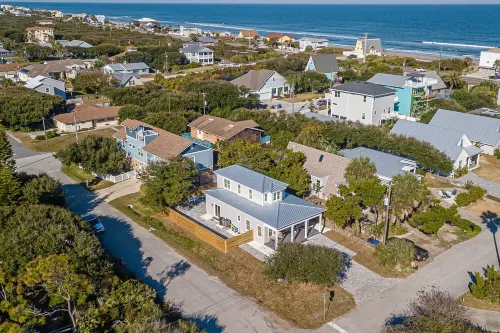 New Luxury heated pool home, steps to the beach with two master suites!