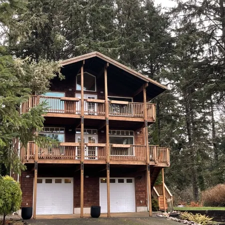 private hot tub, fun game room, cozy beach house