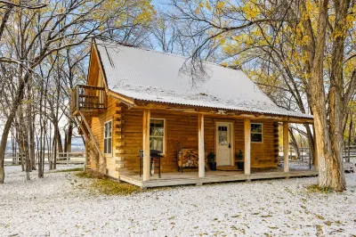 Cozy Log Cabin located on scenic acreage with trees and privacy.