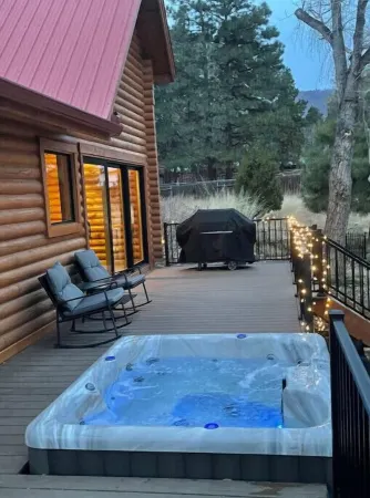 Cheerful Cabin with large stone patio and hot tub, next to trails!!