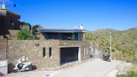 A charming family home with private pool in Cadaques with sea views.