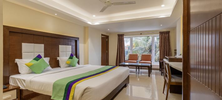 Treebo Suvarna Comforts Hotels in Hassan