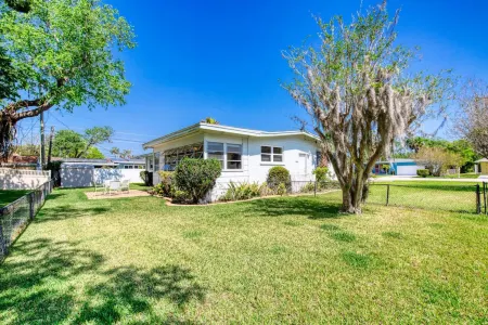 Charming Waterside Retreat with Enclosed Florida Room