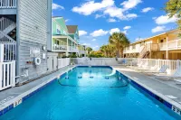 Beautiful home across from beach with pool, central AC, balcony & washer/dryer