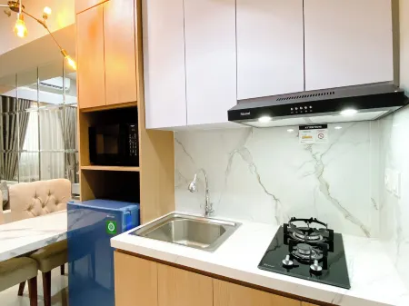 Homey and Minimalist 1Br Vasanta Innopark Apartment Отели рядом с достопримечательностью «Bonecom Tricom Mm2100»