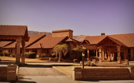 Villa de Merlo Hotel Spa Отели в г. Хунин