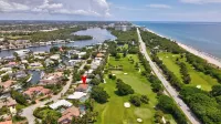 Steps from the beach, heated pool, and ocean sunrises from your patio