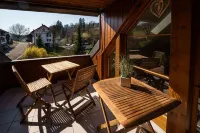 Beautiful penthouse duplex apartment with balcony surrounded by greenery